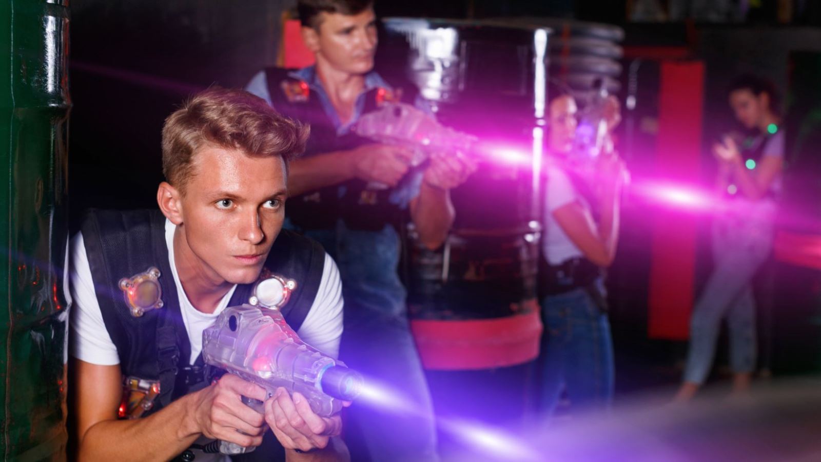 A teenager firing a laser gun